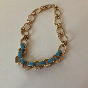 Gold toggle statement necklace. Blue enamel